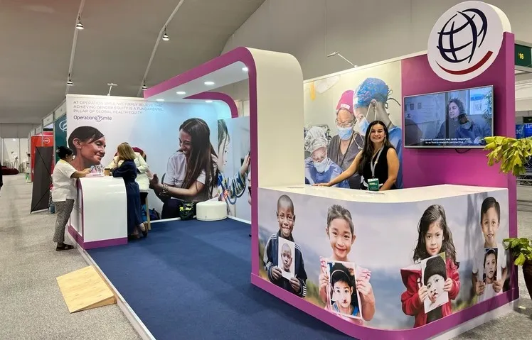 Kelly smiles at the camera from the Operation Smile booth during Women Deliver 2023 in Kigali, Rwanda.