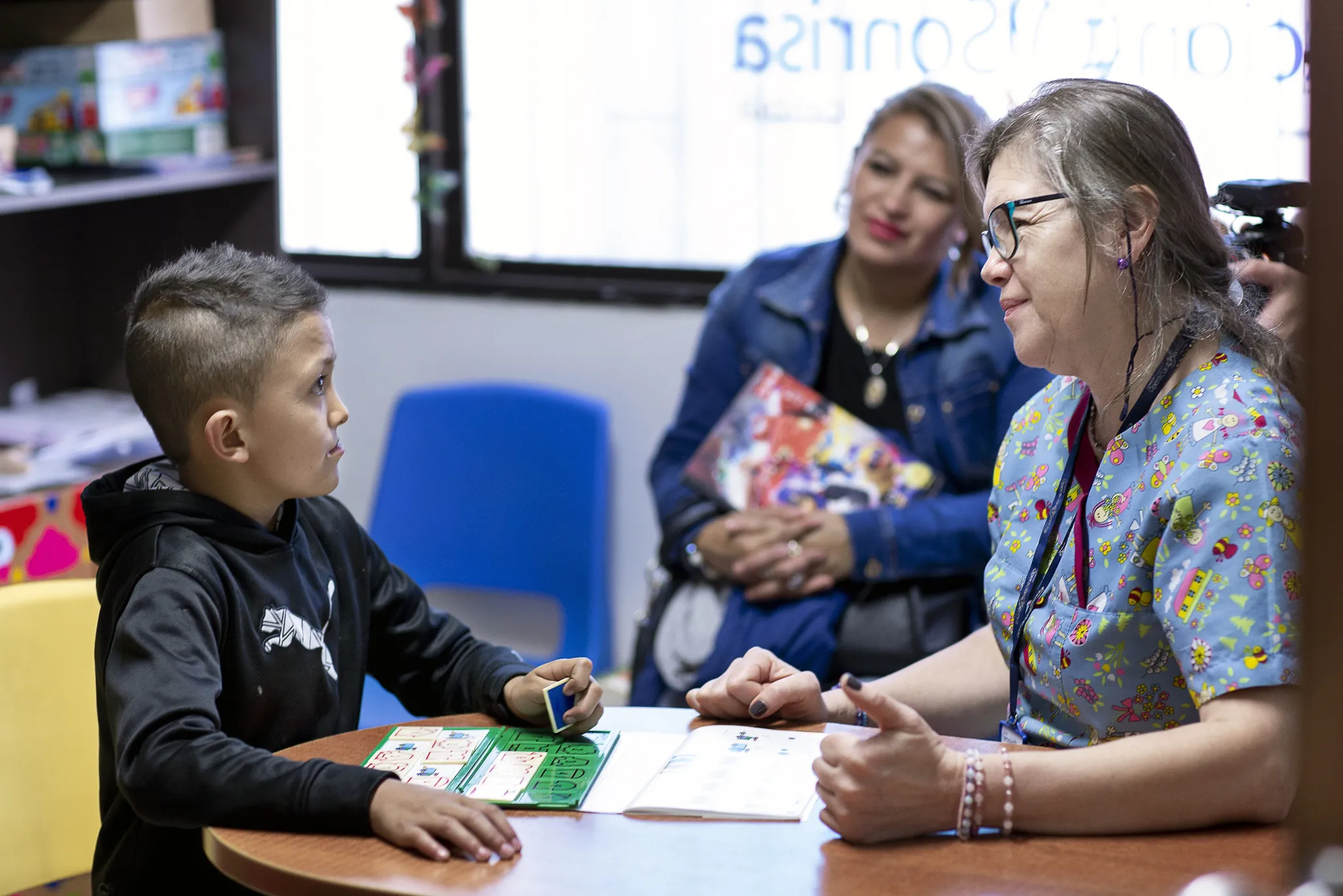 Operation Smile Colombia volunteer psychologist Nubia Bercerra works with a young patient at the Operation Smile Colombia care center in Bogotá, Colombia.