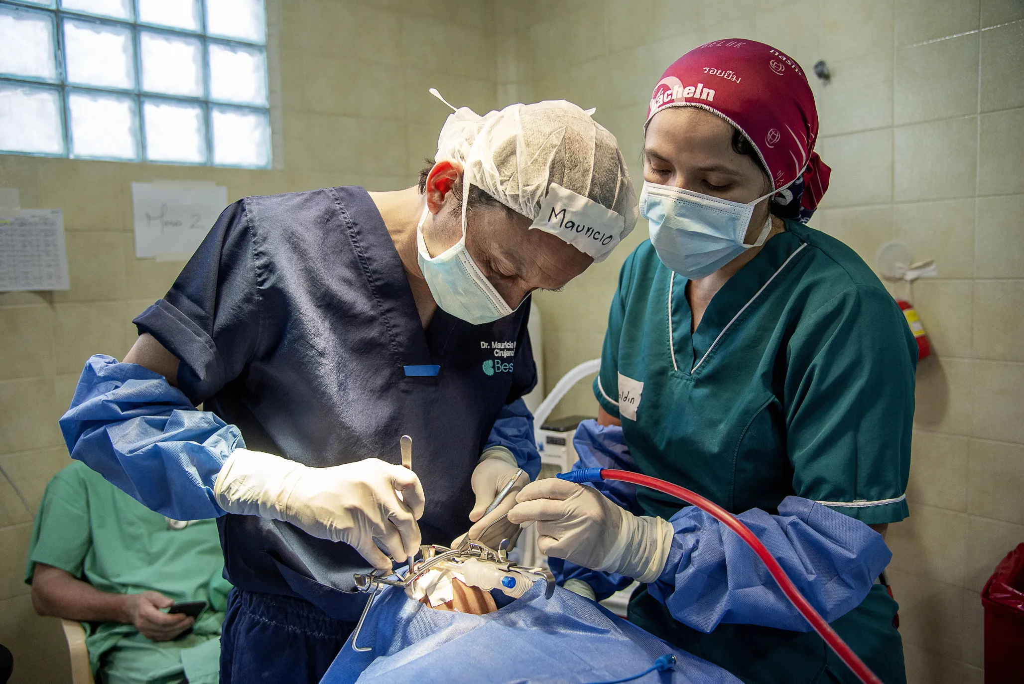 Dr. Mauricio Herrera, volunteer cleft surgeon and Operation Smile Colombia's medical director, left, performs surgery with the support of volunteer nurse Geraldin Ximena Rodriguez Tachak during the August 2019 local program in Riohacha, Colombia.