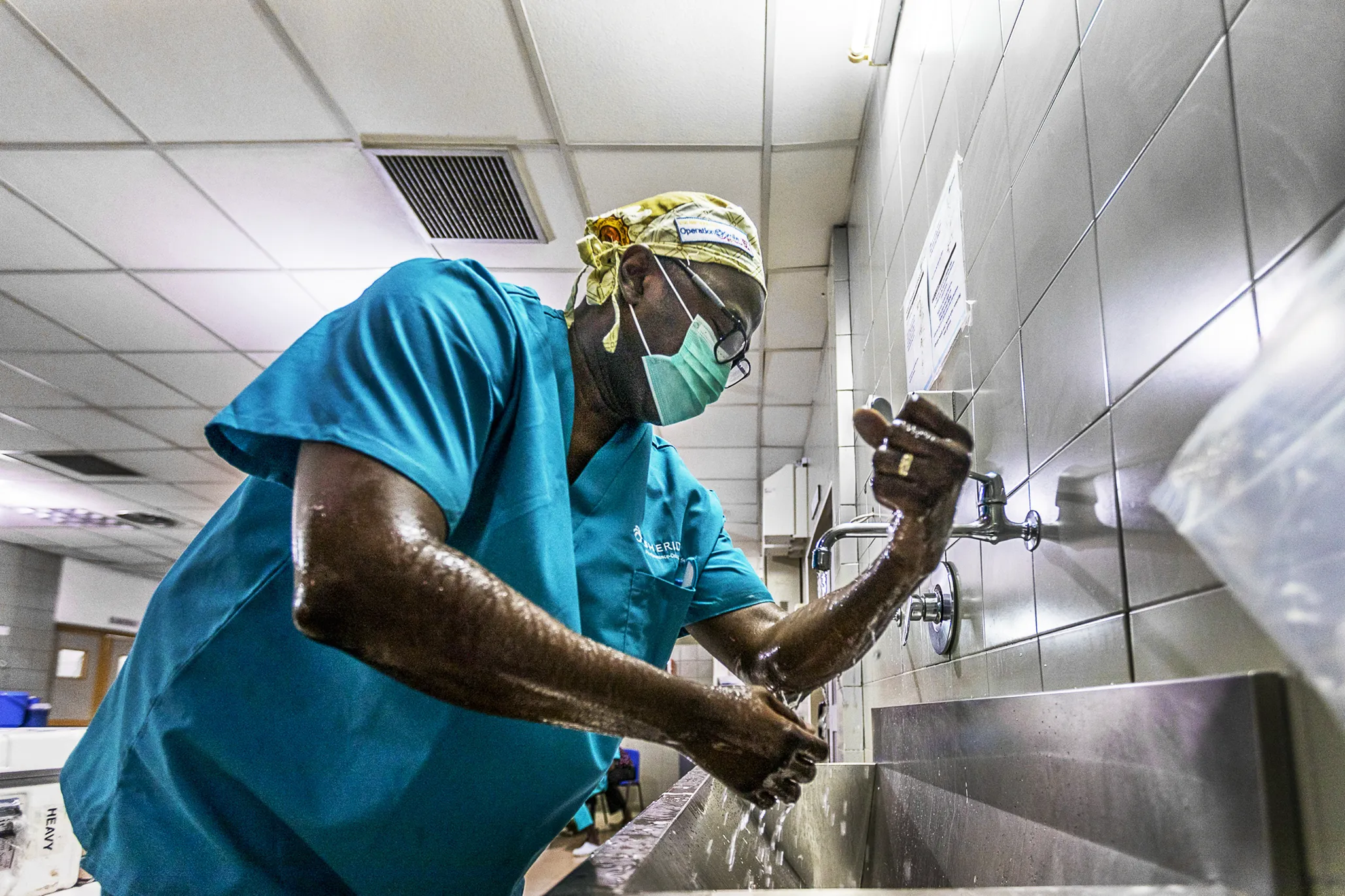 Operation Smile Ghana medical director and cleft surgeon Dr. Opoku Ampomah scrubs in during the January 2018 surgical program at Eastern Regional Hospital in Koforidua, Ghana.