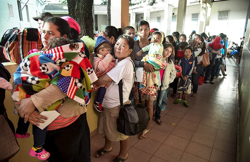 Families wait for a comprehensive health screening during a surgical program in Honduras.