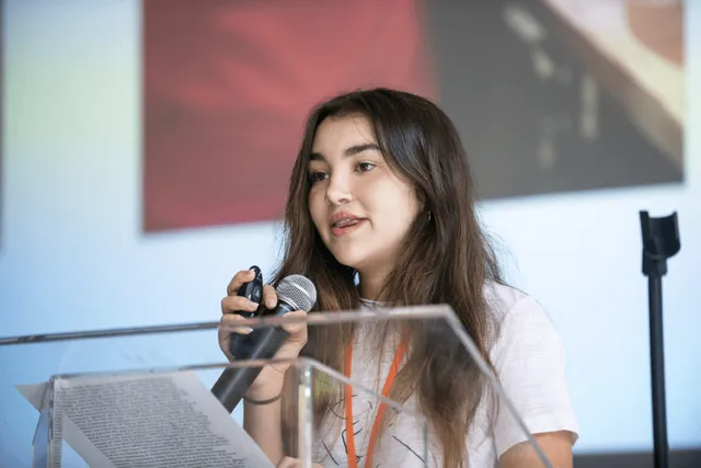 Patient advocate Laura Alvarez speaks at the International Student Leadership Conference.