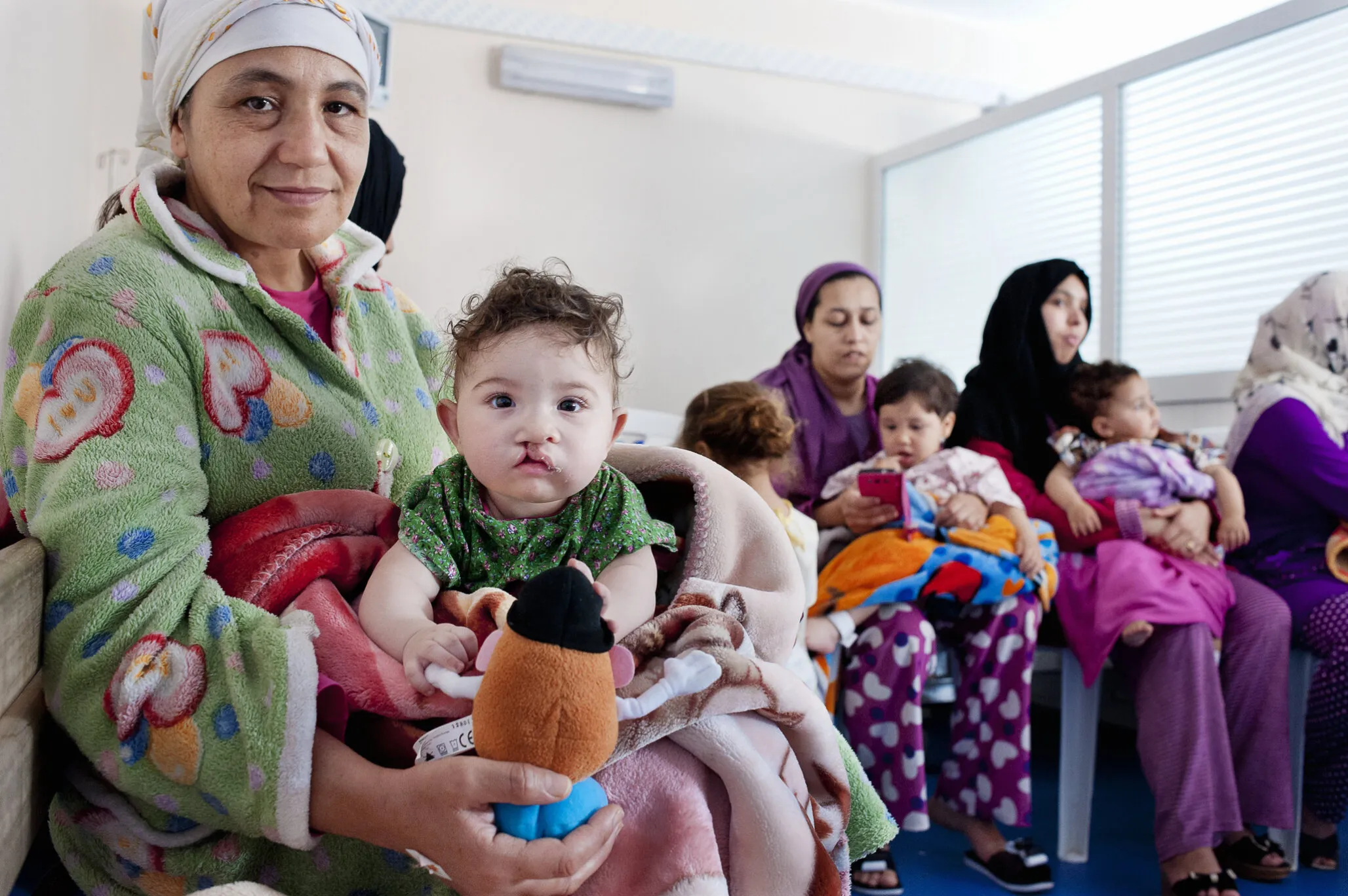 Rania arrives with her grandmother, Nour, ready for cleft surgery.