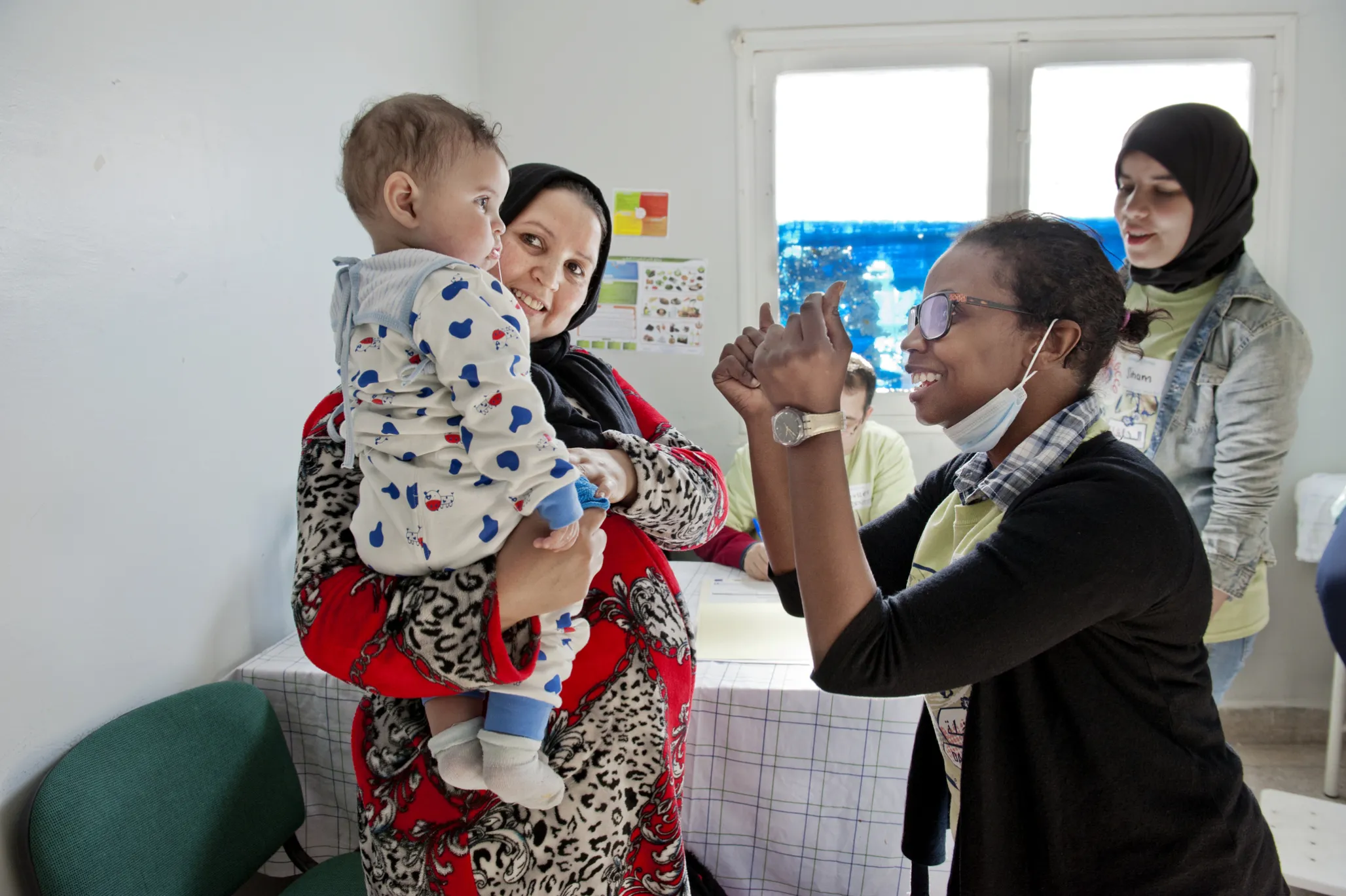 During Operation Smile Morocco's 2015 surgical mission in Dakhla, volunteer dentist Dr. Lo Hanane of Morocco examines Mohamed during the screening process.