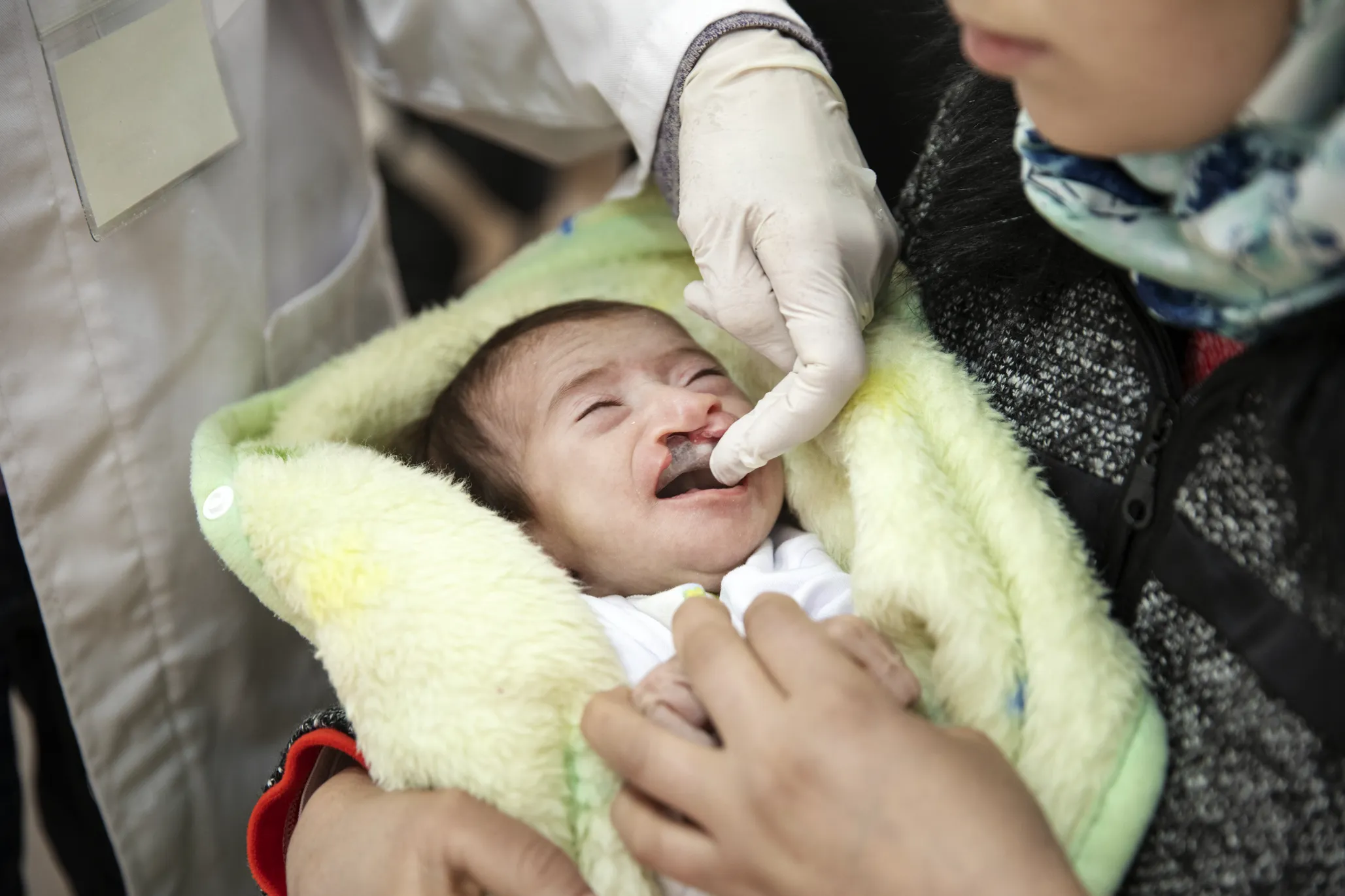 During the March 2020 surgical mission in Oujda, Morocco, Janat tries out her new feeding plate for the first time.