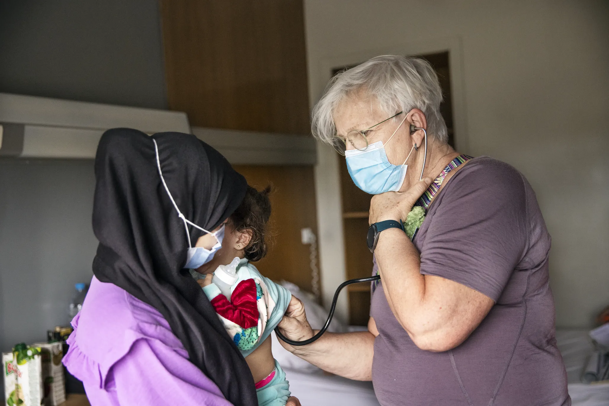 Volunteer anesthesiologist Dr. Anne-Marie Banning from Sweden examines Janat during her comprehensive health evaluation.