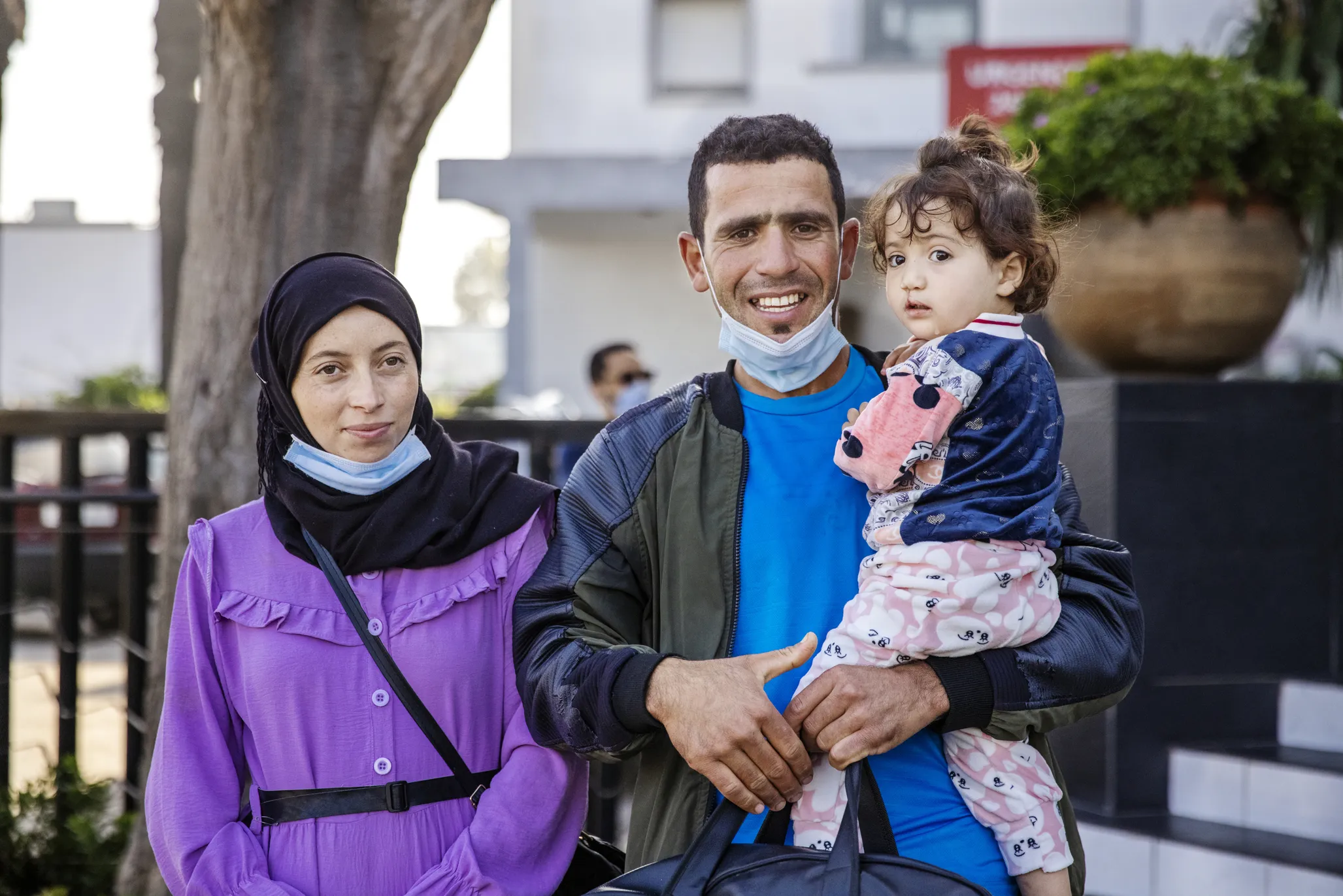 Janat, after surgery, with her parents.