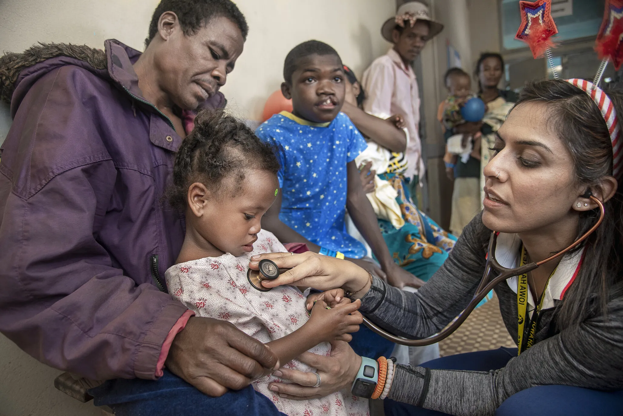 Operation Smile volunteer pediatrician Shelly Batra of the United States checks Brunel's vital signs.
