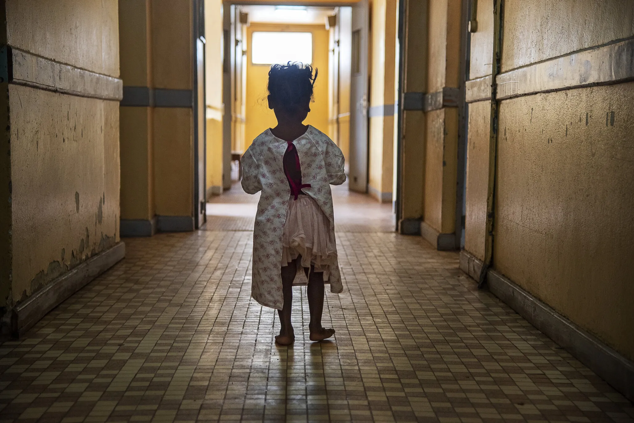 Brunel stands in a hallways before surgery.