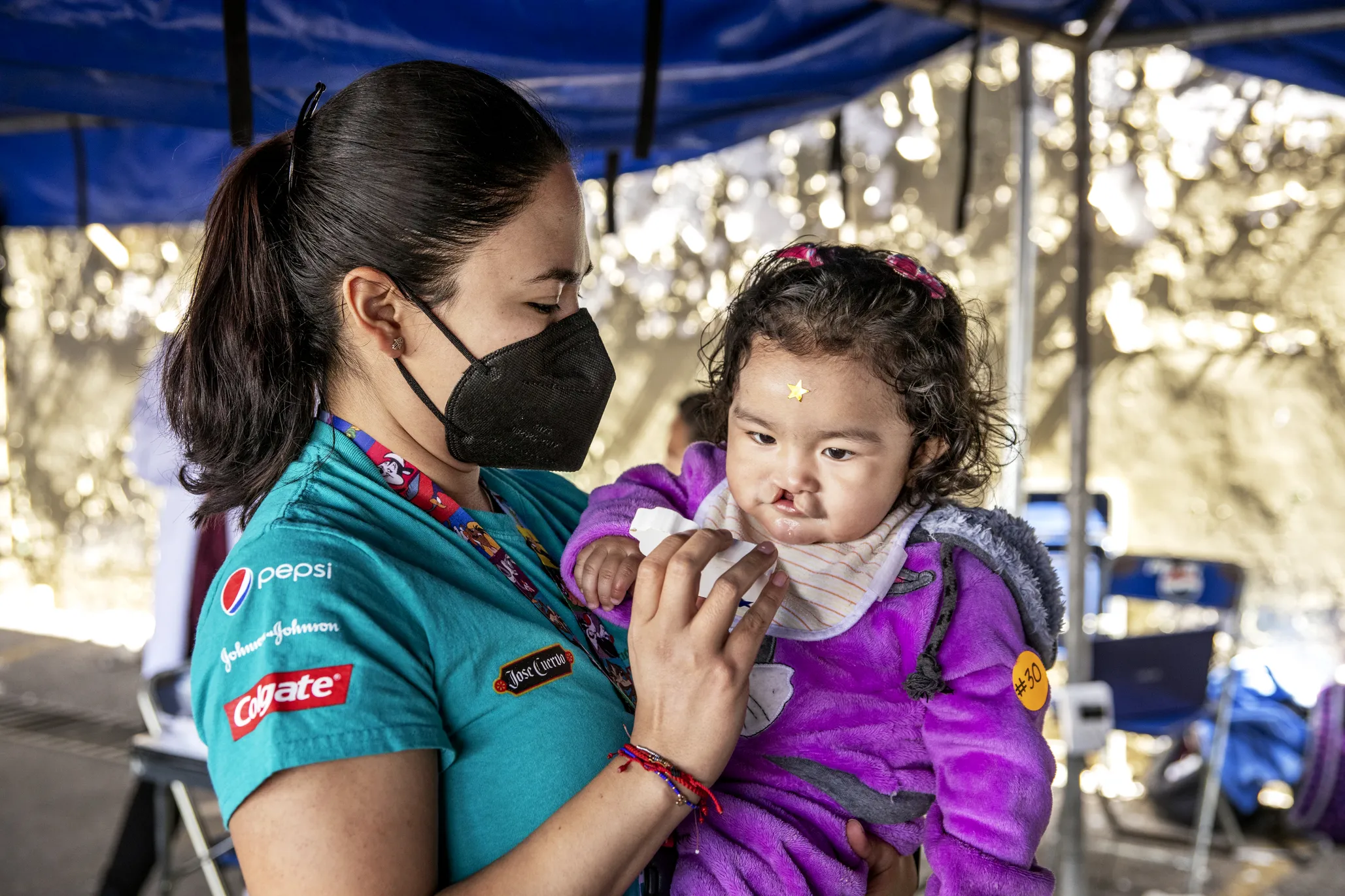 Lilia is examined by Operation Smile volunteers during a surgical program in Puebla, Mexico.