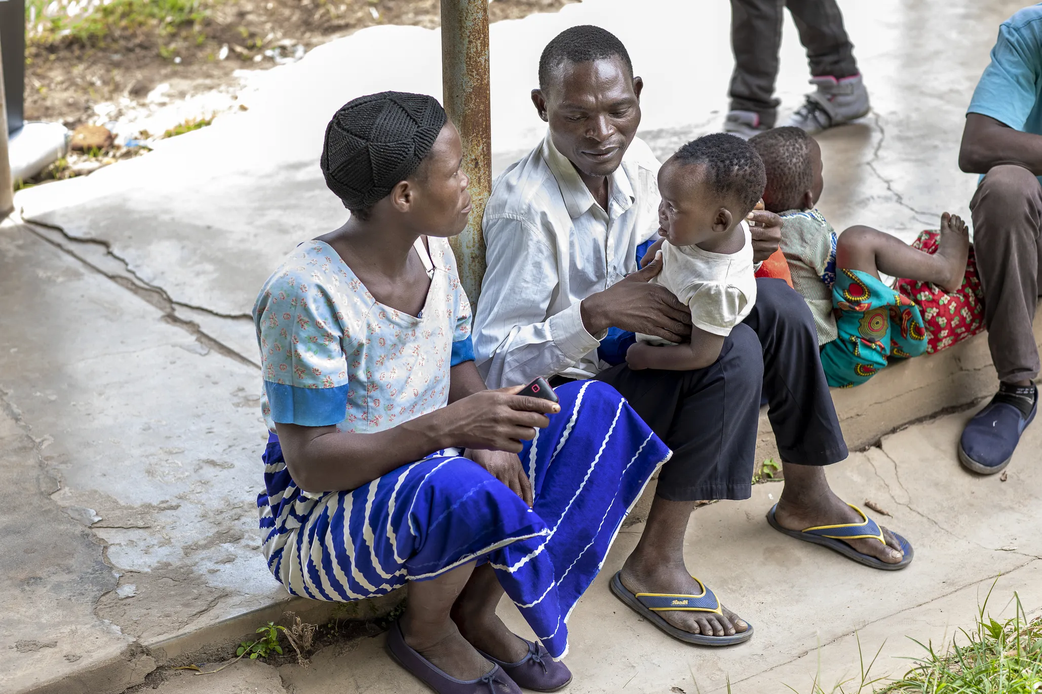 Esner, sits beside her husband, Antony, who holds Sunday in his arms.