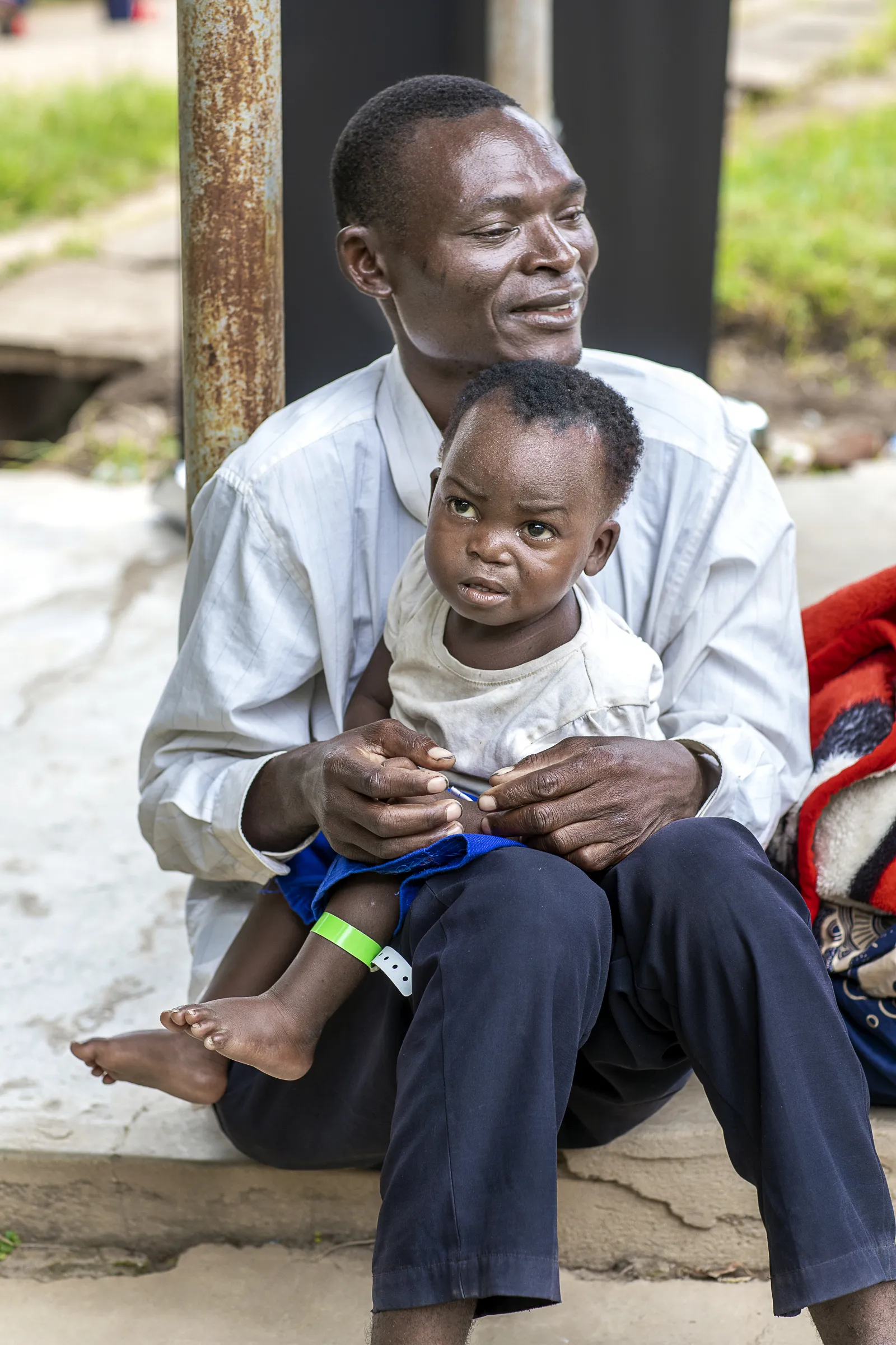 Antony, Sunday’s dad, holds his son one year after surgery.