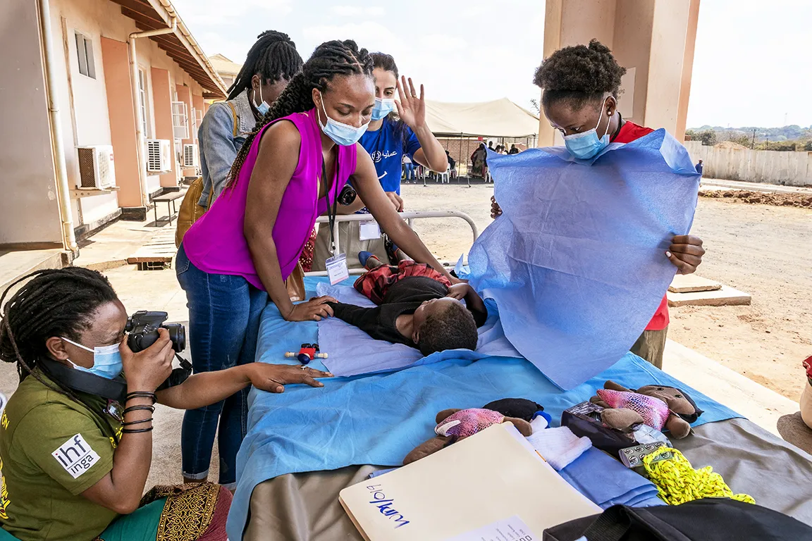Carol Chigona assists volunteer patient imaging technicians during screening at Operation Smile Malawi’s 2022 Women in Medicine surgical program in Lilongwe, Malawi.