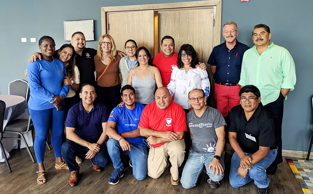 The instructors of the Panama MegaAHA meet with leaders of the Operation Smile’s medical oversight team: Chief Medical Officer Ruben Ayala (front left), Director of Nursing Practice Ann Campbell (back, third from left) and Associate Chief Medical Officer Geir Stangeland.