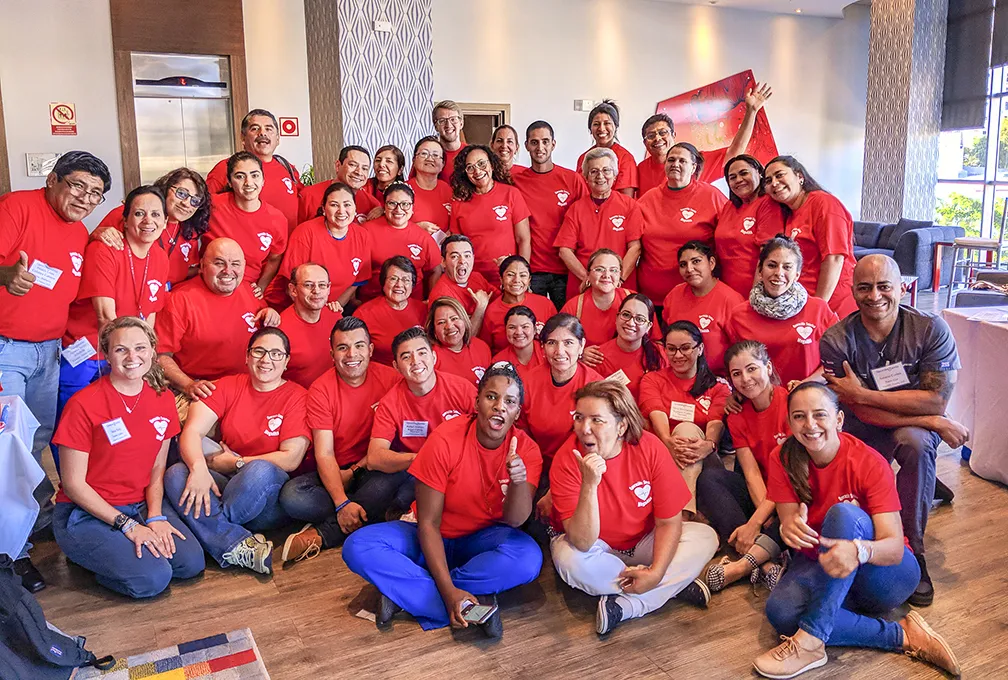 AHA instructors, trainees and Operation Smile staff pose for one last photo on the final day of Panama MegaAHA.
