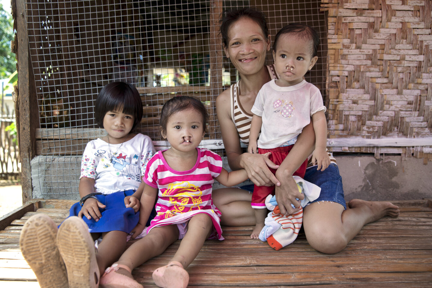Loraine, after surgery, sits with friends and family.