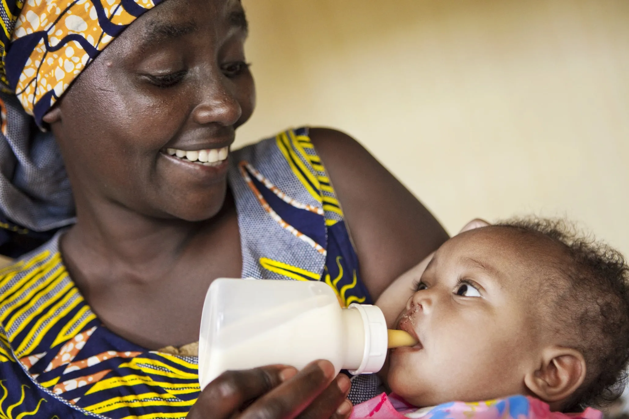 A patient enjoys a bottle during a program in Kigali, Rwanda.