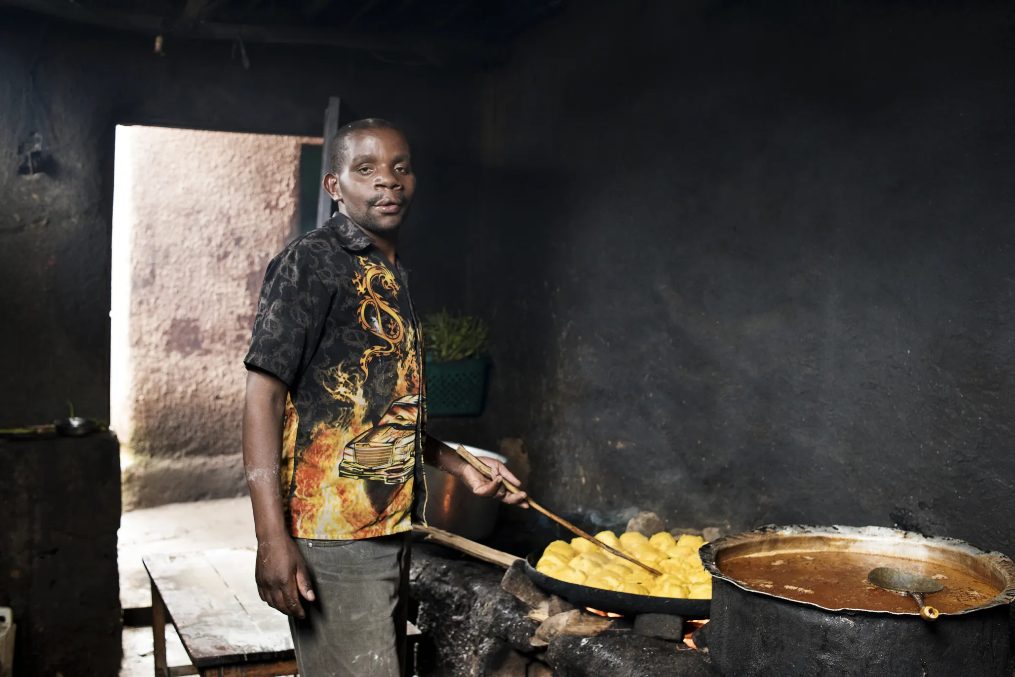 Enok takes a moment while cooking dinner.
