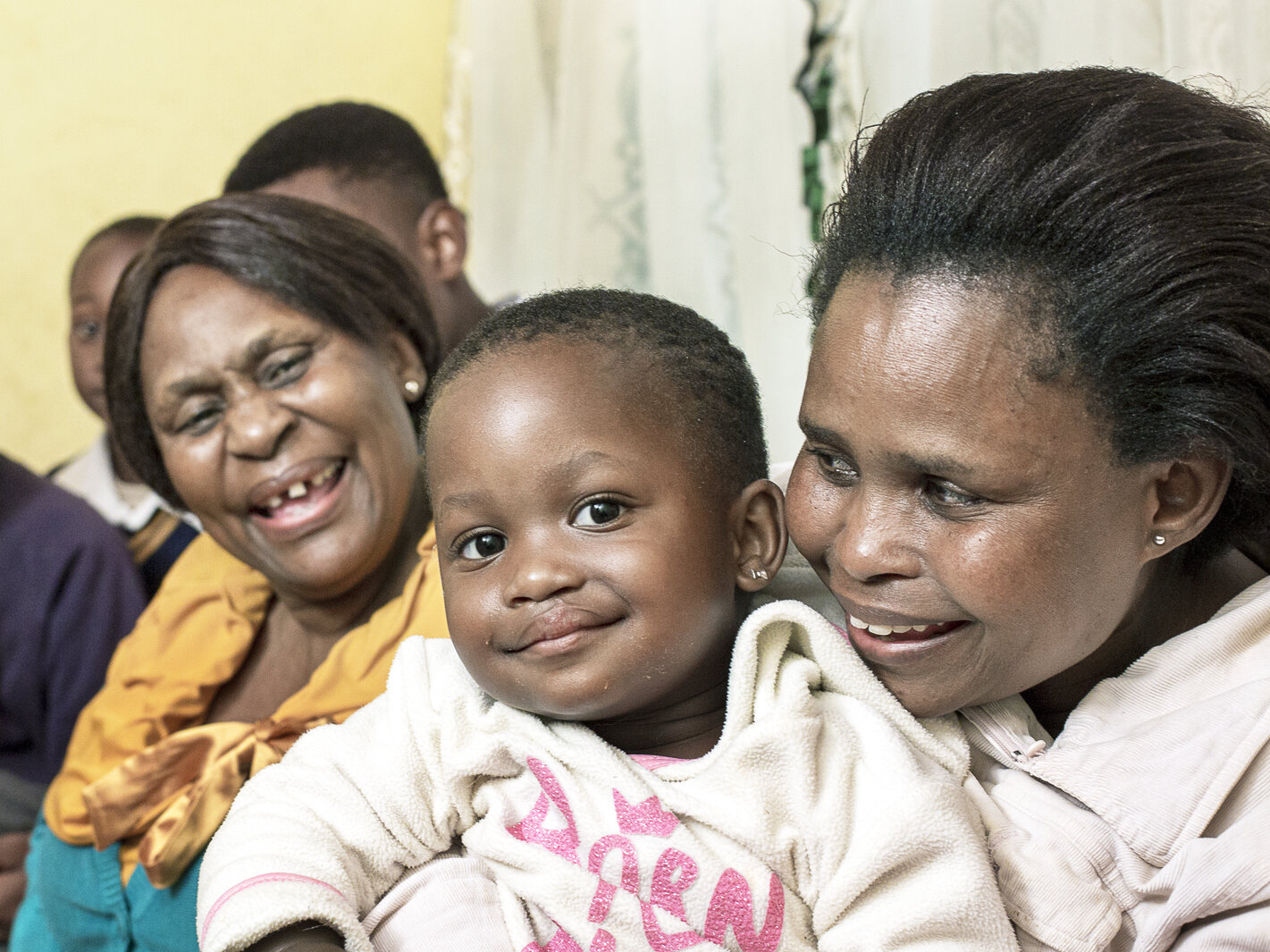 Lungile poses with her family after surgery.