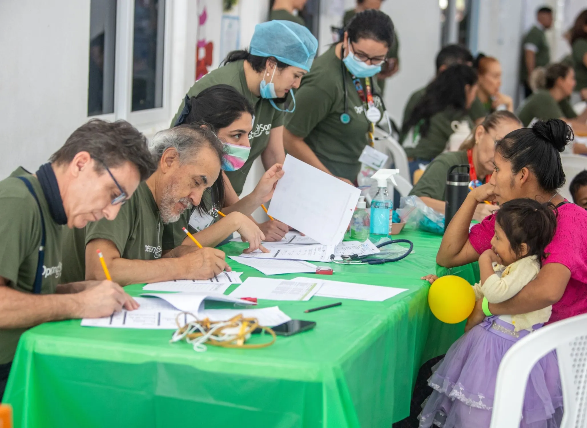 Health care providers check in patients during a surgical program in Guatemala.