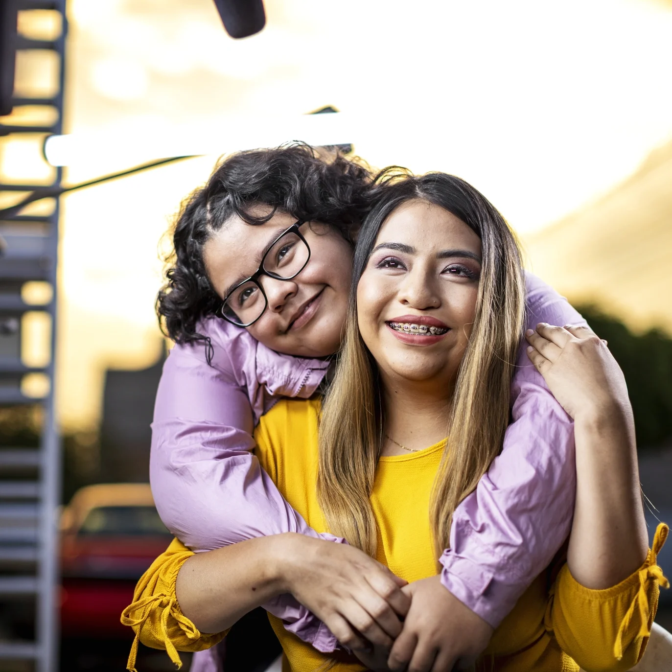 Two friends smile for the camera