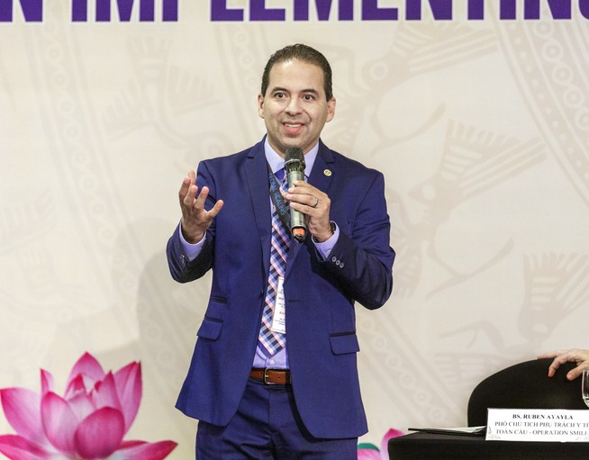 Operation Smile Chief Medical Officer Dr. Ruben Ayala speaks at an event in Vietnam in 2019. 