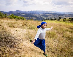 Four years after her first surgery, Nazfia frolics in a field near her home in Ethiopia.