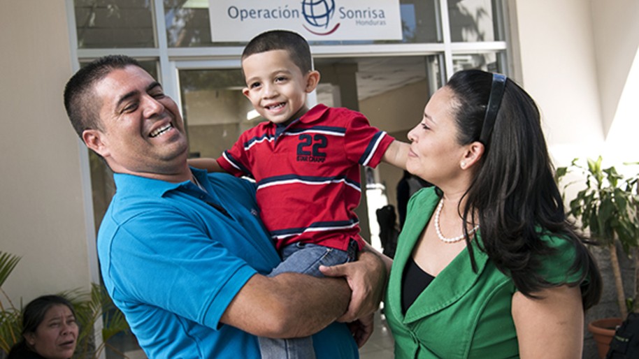 Patient advocate Alex Guerrero with his wife, Adilia, and son, César, at the Operation Smile Cleft Lip and Cleft Palate Integral Care Clinic in Tegucigalpa, Honduras. Don Alex was so happy with the care his son received from Operation Smile that he started looking for other people with cleft conditions, giving them support and information and helping them get to Operation Smile surgical programs. Photo: Rohanna Mertens.