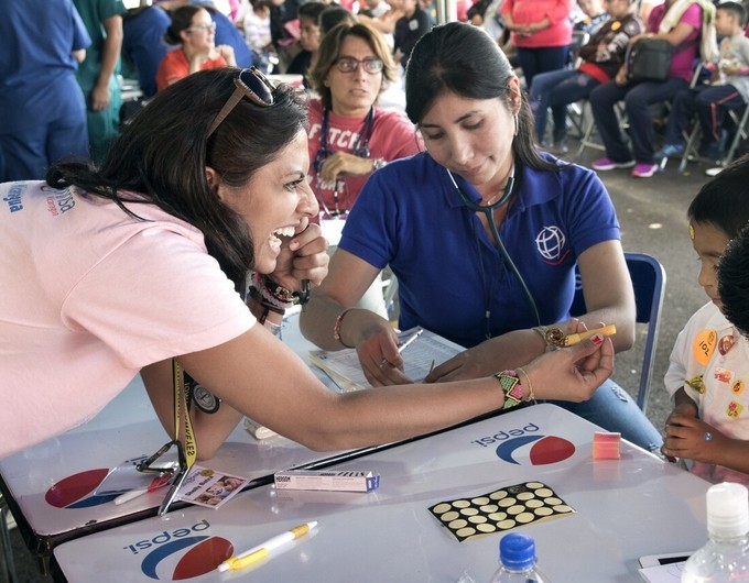 Pediatrician Shelly Batra with a patient on Operation Smile Mexico's first day of screening at Hospital Betania Puebla in Puebla, Mexico.
