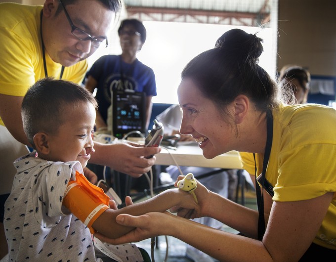 Recovery Room Nurse Ida Nilsson from Sweden and Recovery Roon Nurse John Ryan Yap from the Philippines with 5-year-old Joseph.