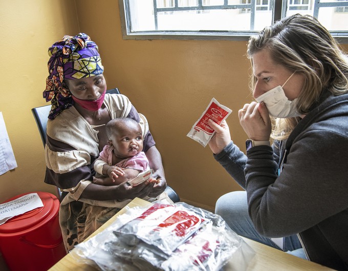 Charlotte Steppling, Director of Nonsurgical Programs, provides the mother of 11-month-old Silas with a nutritional consultation in Bushenge, Malawi in March 2022.