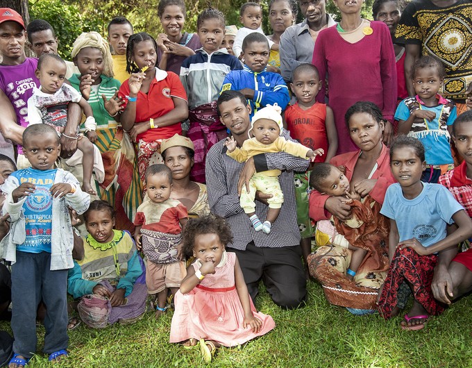 Posed for a group picture, Operation Smile Madagascar patient advocate Fidelis is at the center while some of the 42 patients he found and brought to Operation Smile's patient village during a 2018 program.