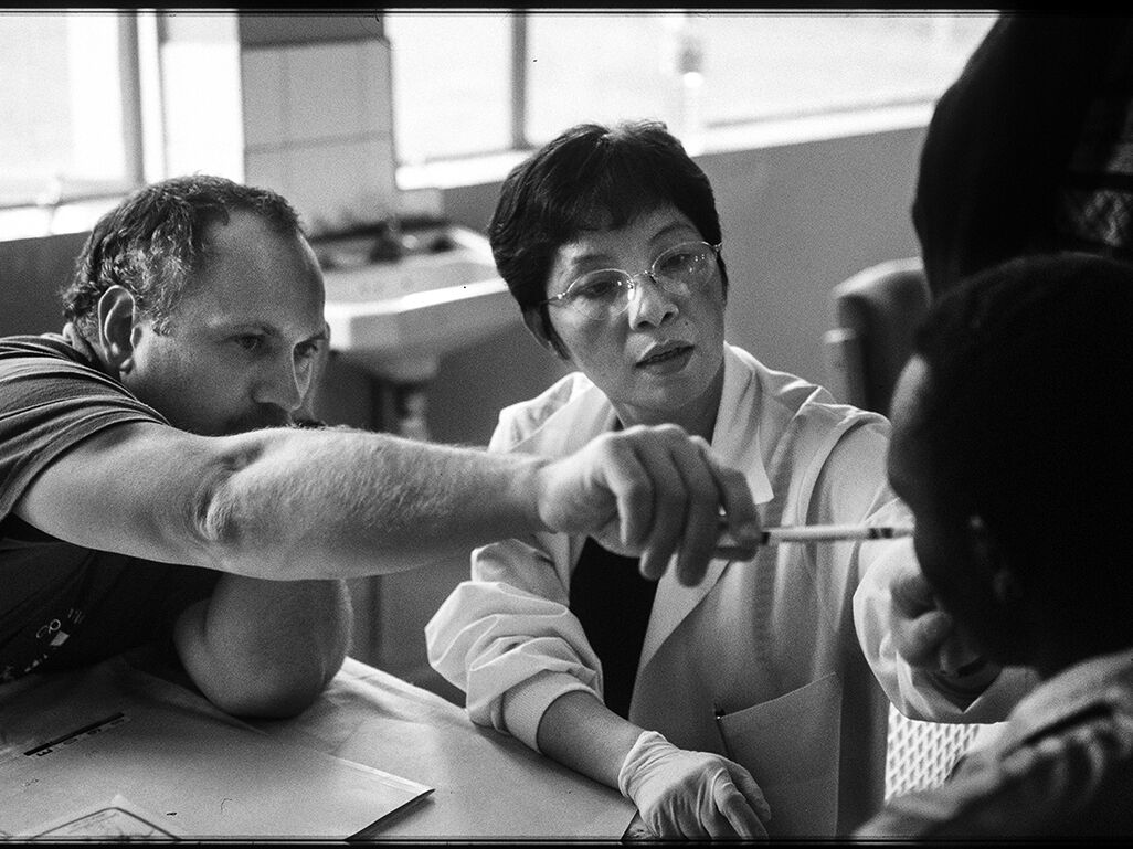 Russian surgeon Sergey Bessonov and Vietnamese surgeon Lam Hoai Phuong screen a patient at the Rift Valley Provincial Hospital.