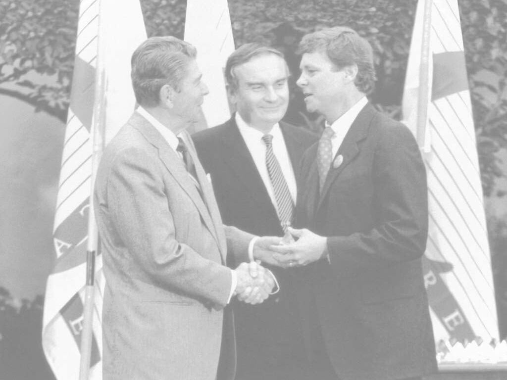 Operation Smile Co-Founder Bill Magee speaks with U.S. President Ronald Regan.