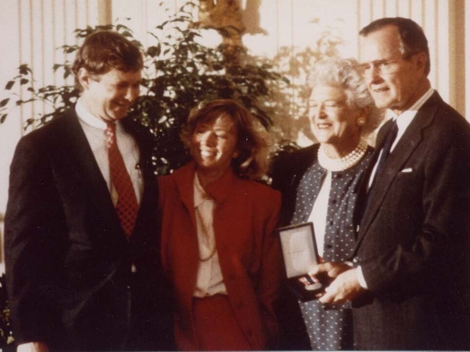 Operation Smile Co-Founders Bill and Kathy Magee smile while receiving an award from President George Bush and First Lady Barbara Bush.
