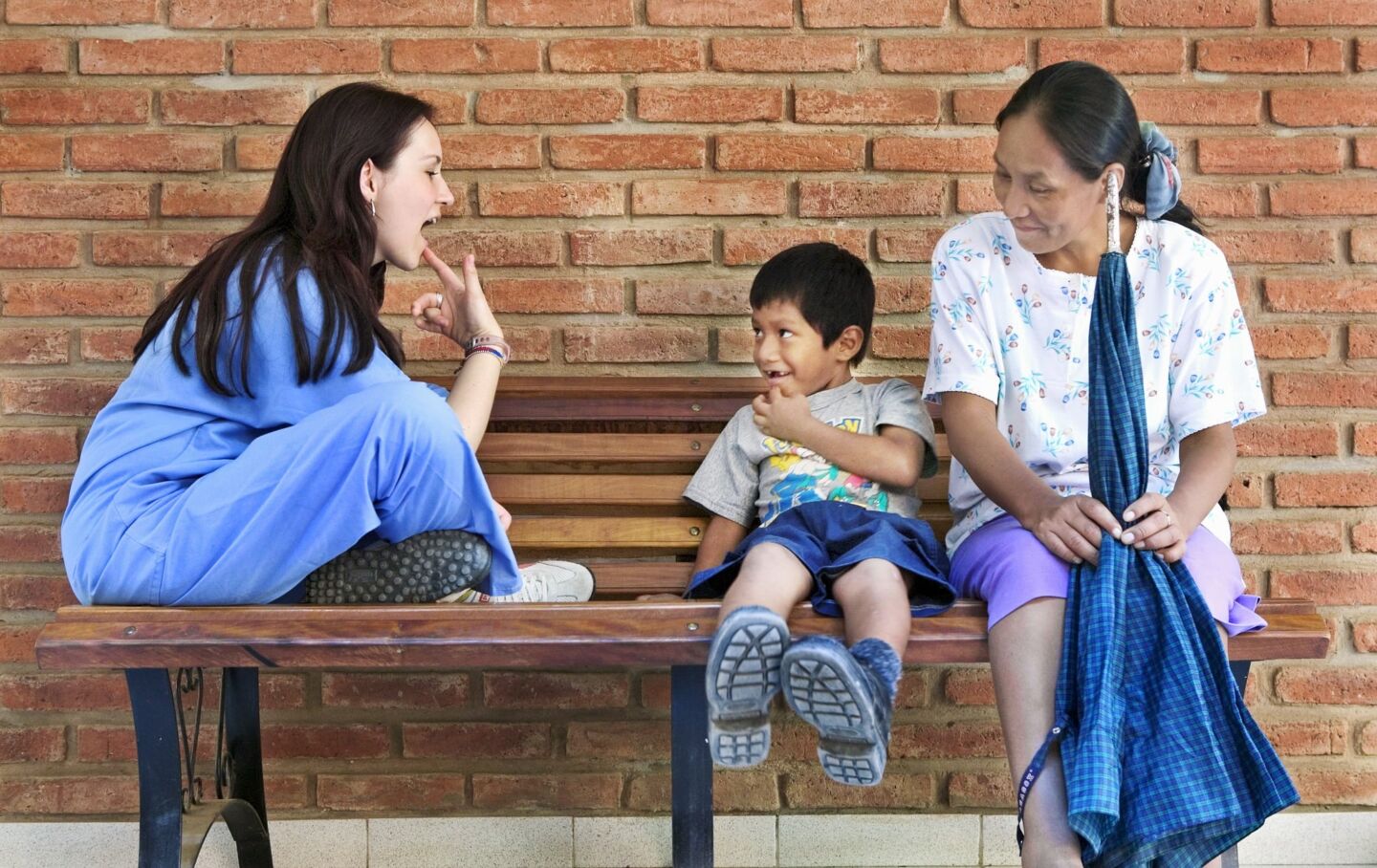 Operation Smile speech therapist Milena Cleves works with a patient.