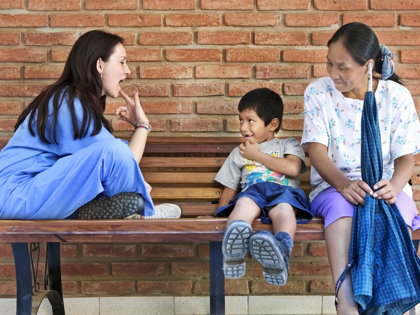 Operation Smile speech therapist Milena Cleves works with a patient.