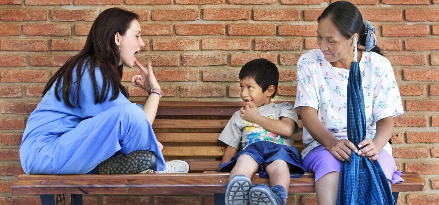Operation Smile speech therapist Milena Cleves works with a patient.