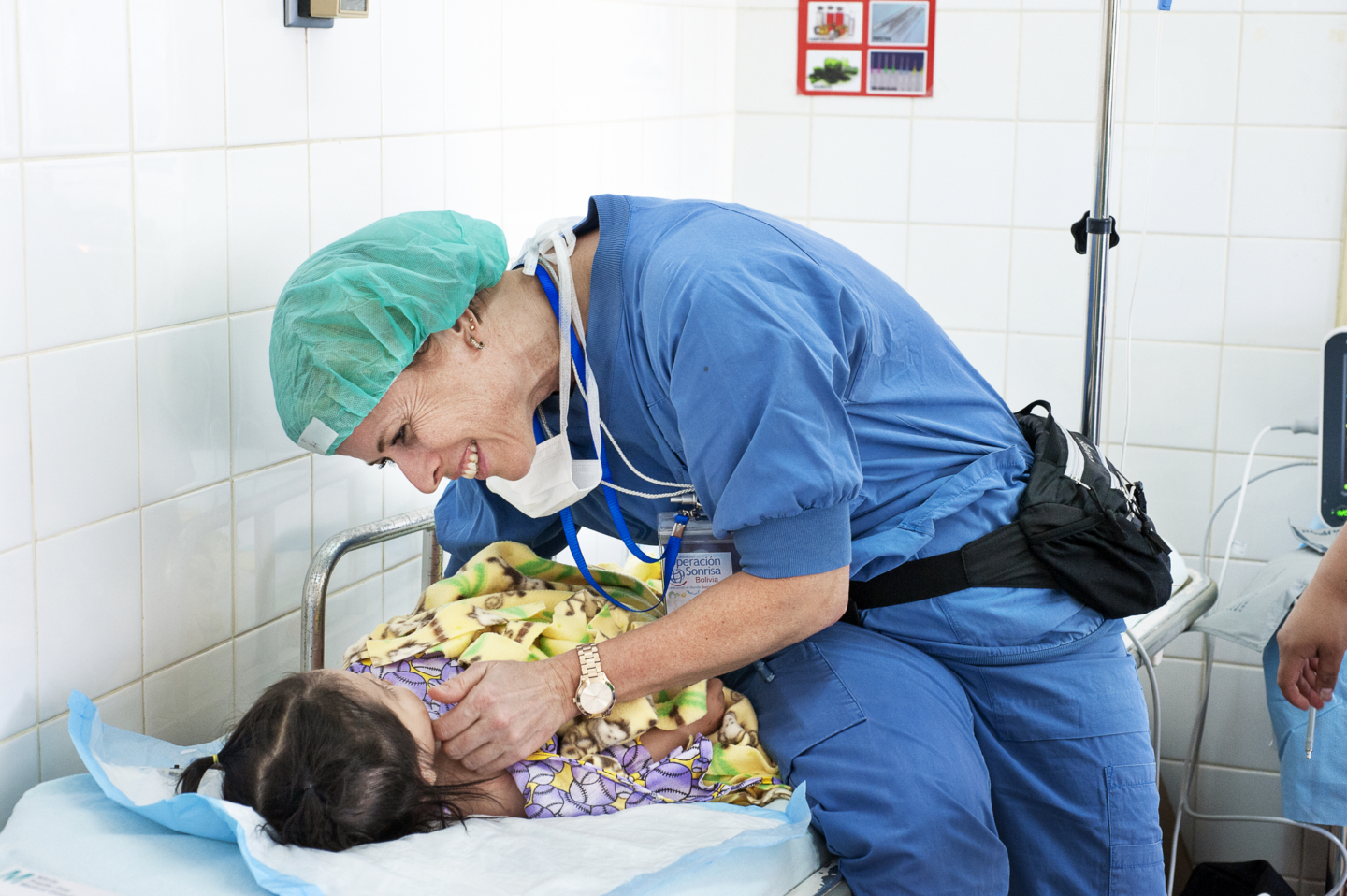 Volunteer pre- and post-operative nurse Asa Ostberg of Sweden checks on how Annika is feeling after her surgery.