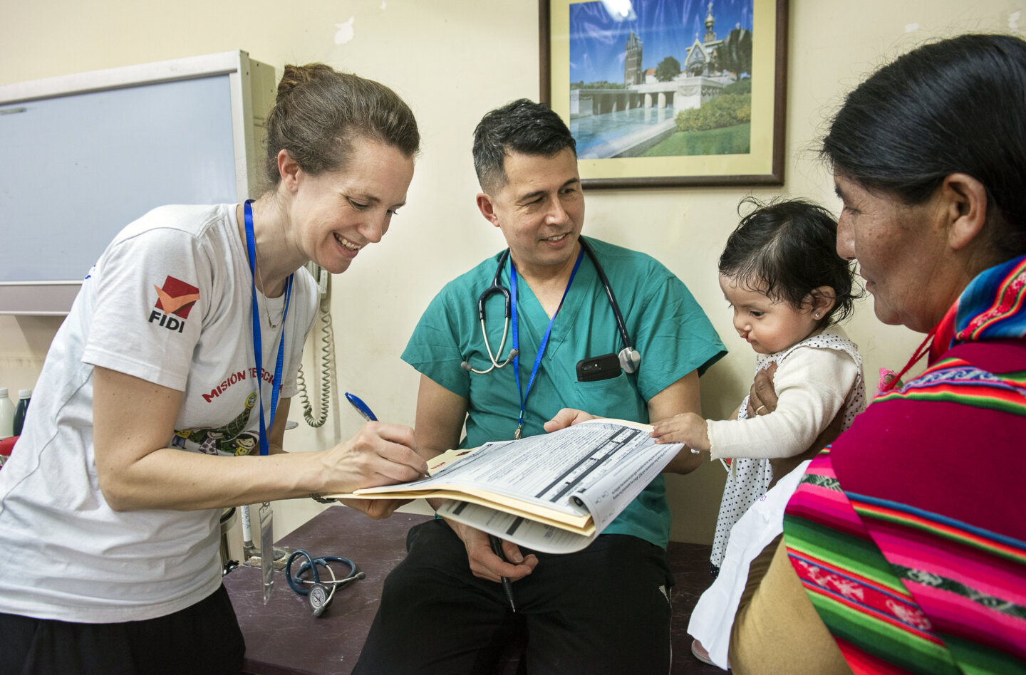 Volunteer pediatric anesthesiologist Dr. Karin Strand of Sweden and volunteer post-anesthesia care unit physician Dr. Ben Hu of the U.S. provide Heydi's comprehensive health evaluation to determine if she's healthy enough to receive cleft surgery during a 2018 surgical program in Santa Cruz.