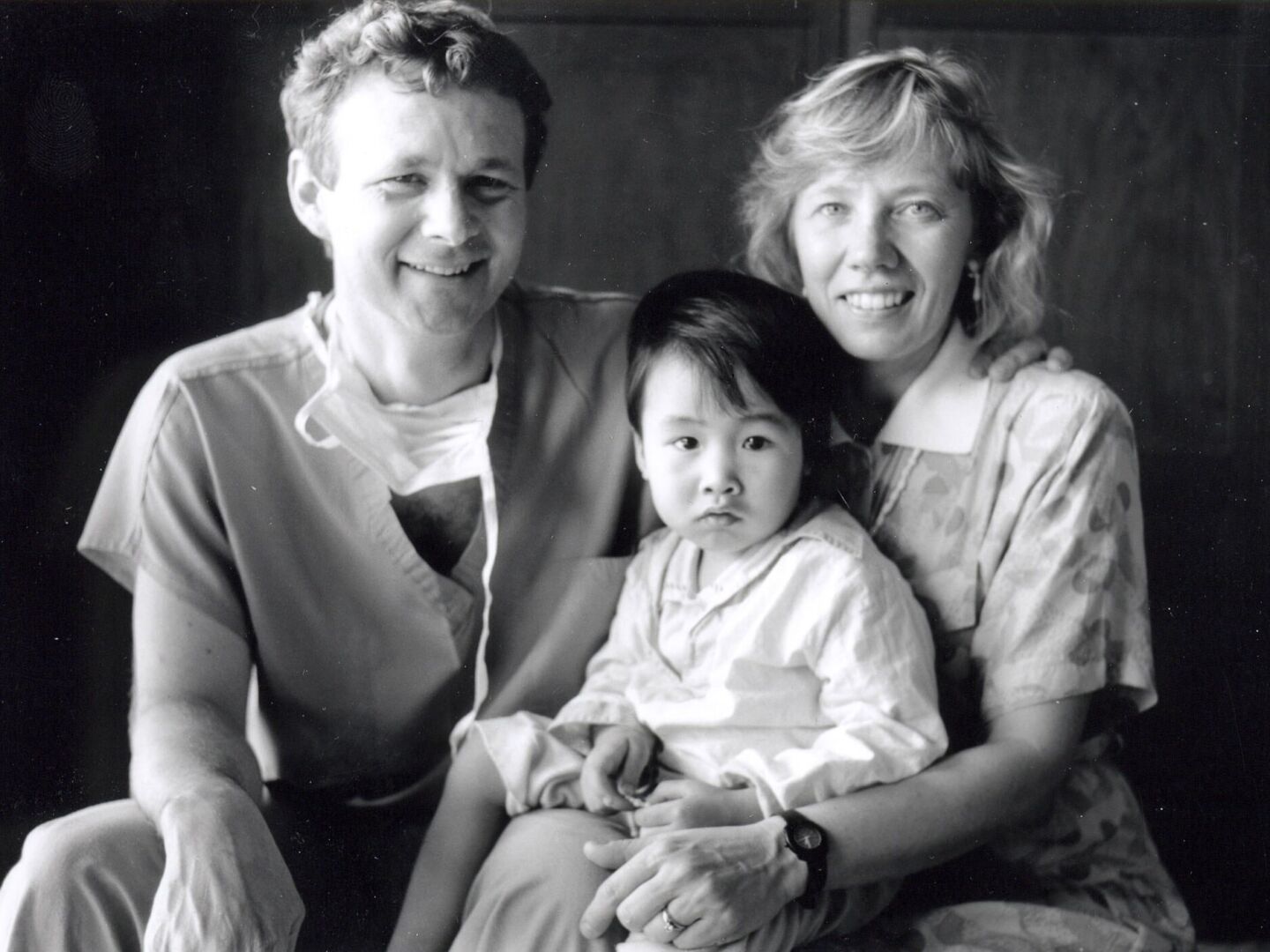 Operation Smile Co-Founders Bill and Kathy Magee smile with a patient during the early years of Operation Smile.