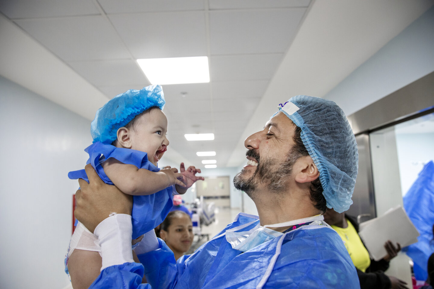 Amaia, before surgery, with an Operation Smile volunteer.