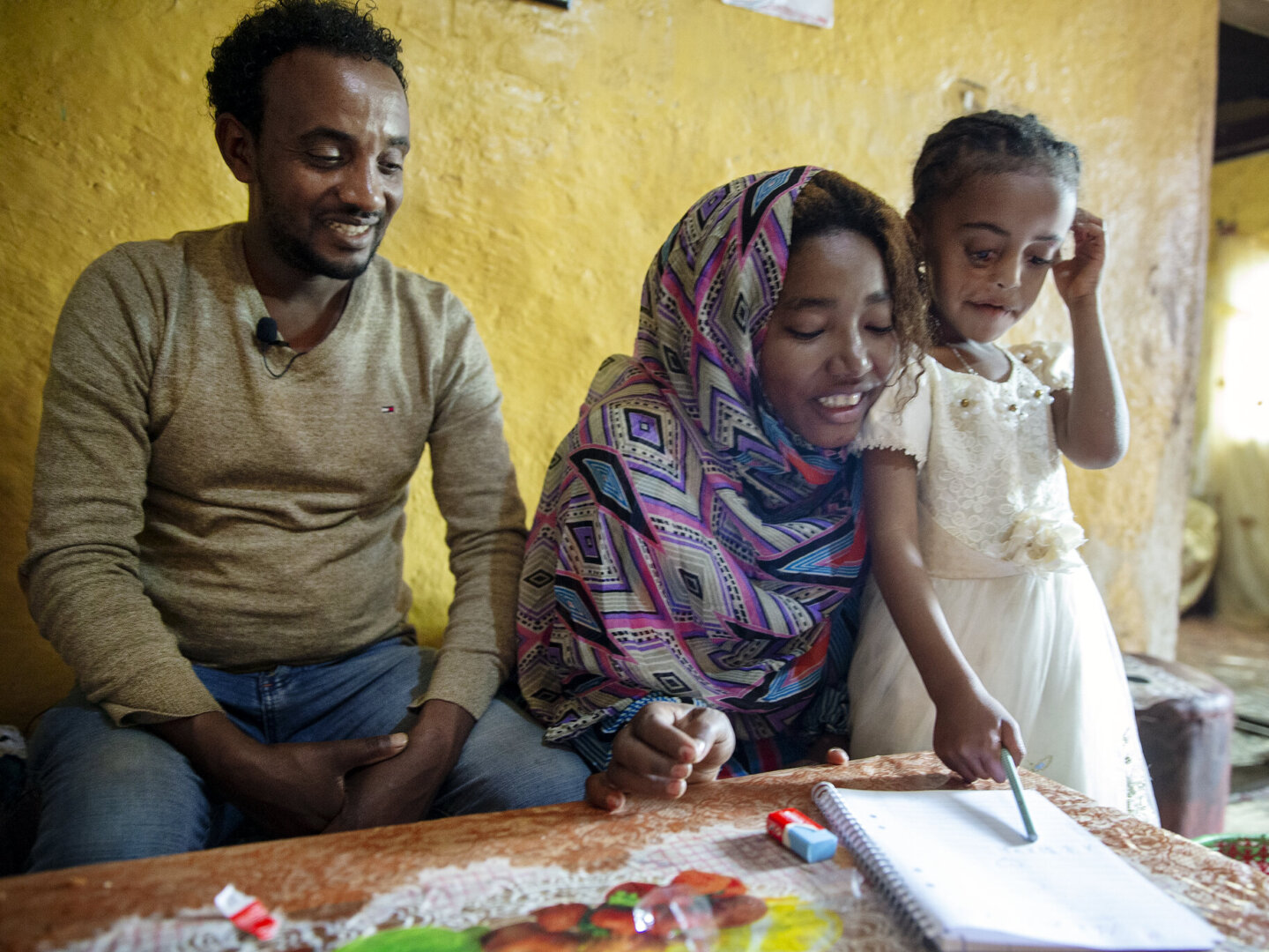 Meheftehe, after surgery, with her parents.