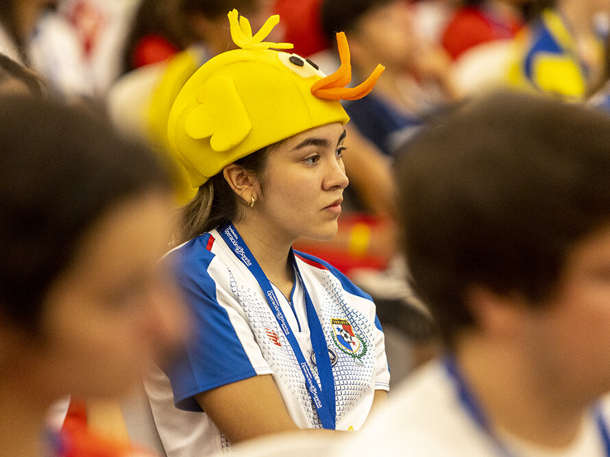 Student volunteer Laura Alvarez listens to a presentation.