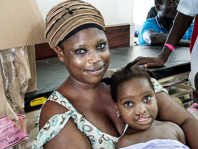 Ramata sits with her mother before surgery.