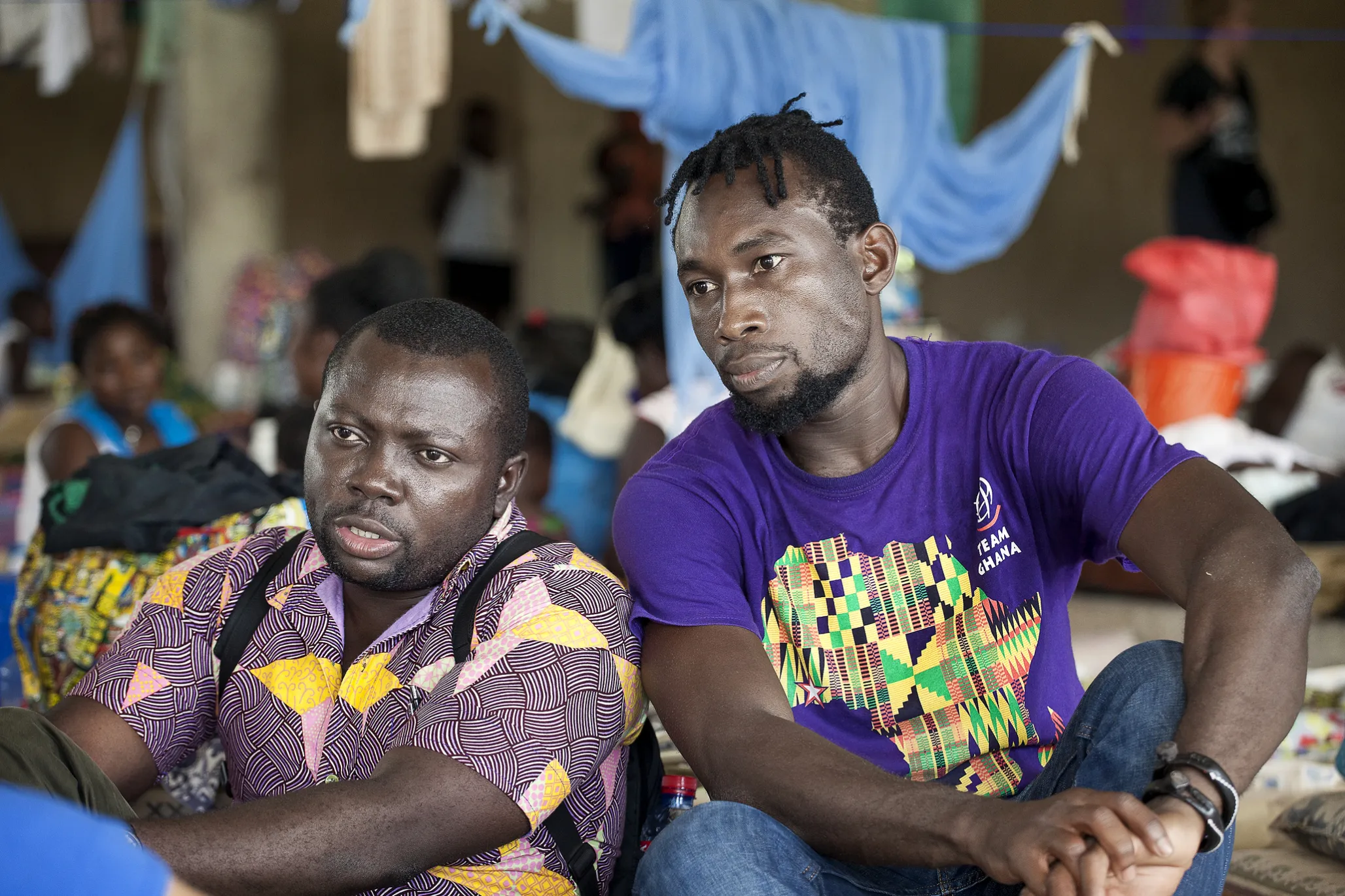 Operation Smile Ghana’s patient coordinator Clement Ofosuhemeng, left, and volunteer Emmanuel Amass Amankwah listen as a patient's mother shares her story during the November 2017 surgical program to Koforidua, Ghana.