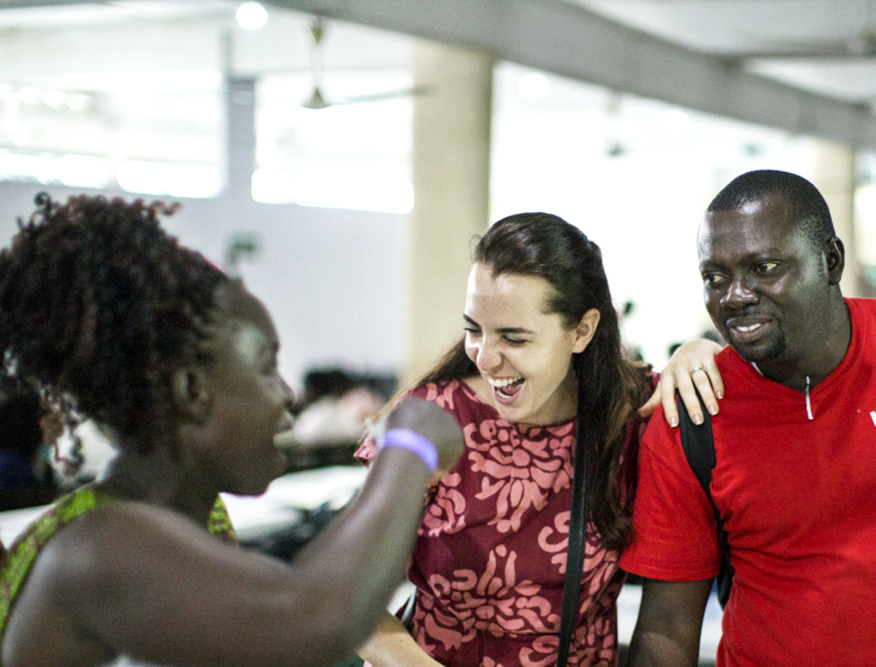 Sabrina Ghiddi, Operation Smile's regional manager of western and southern Africa, shares a laugh with a patient's mother and Clement Ofosuhemeng, Operation Smile Ghana's patient coordinator, during the November 2017 surgical program to Koforidua, Ghana.