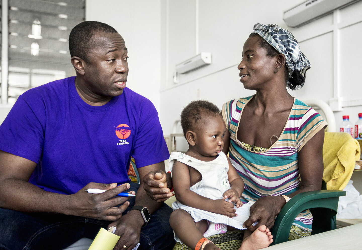 Operation Smile Ghana medical director and cleft surgeon Dr. Opoku Ampomah consults with the mother of a young patient during the November 2017 surgical program at Eastern Regional Hospital in Koforidua, Ghana.