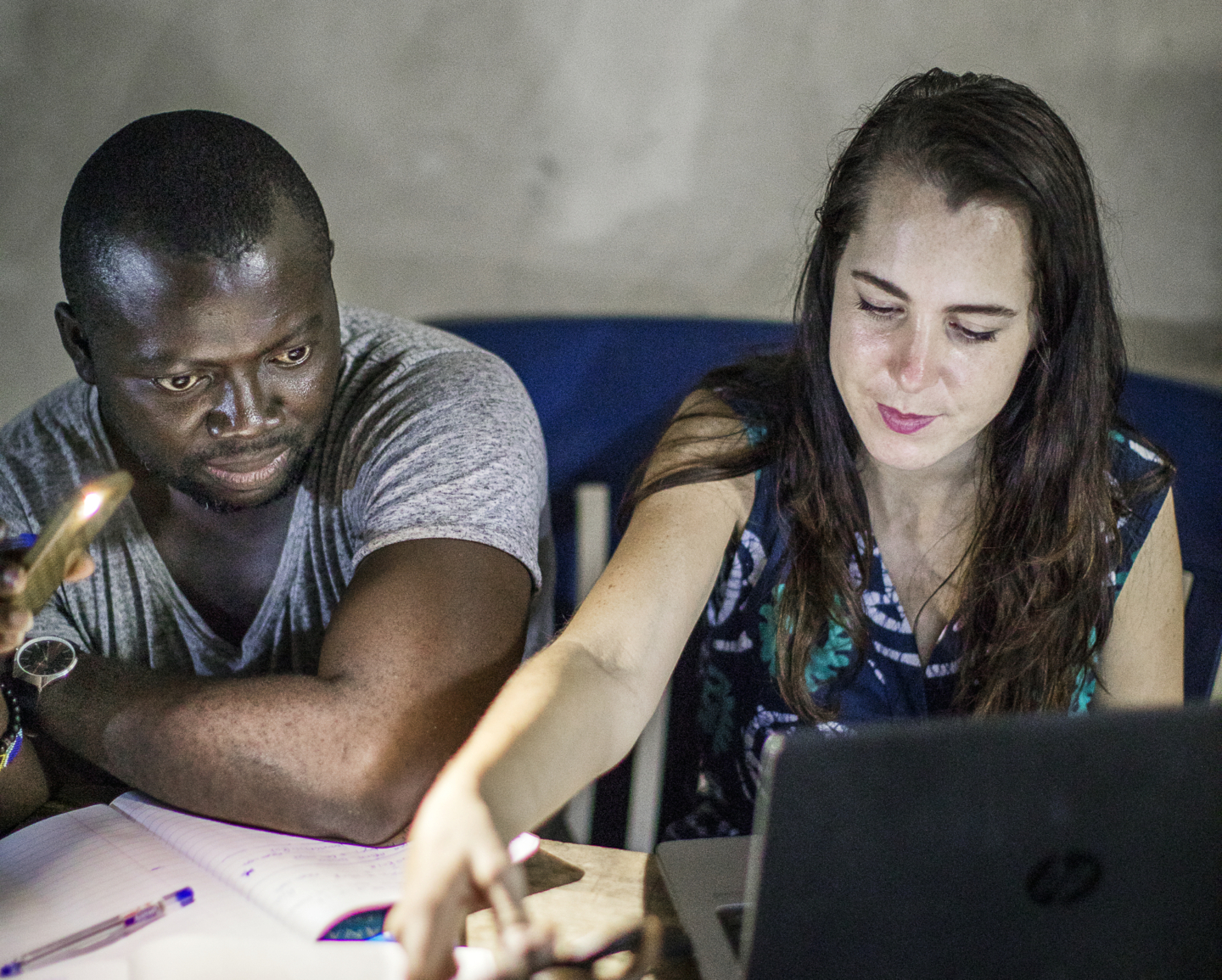 Sabrina Ghiddi, Operation Smile's regional manager of western and southern Africa, and Clement Ofosuhemeng, Operation Smile Ghana's patient coordinator, work late hours at the patient shelter during the January 2018 surgical program to Koforidua, Ghana.