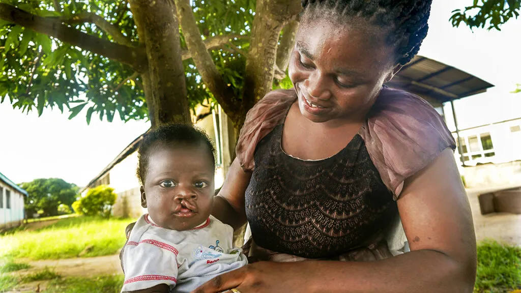 Kelvin with his adoptive mother, Felicia.